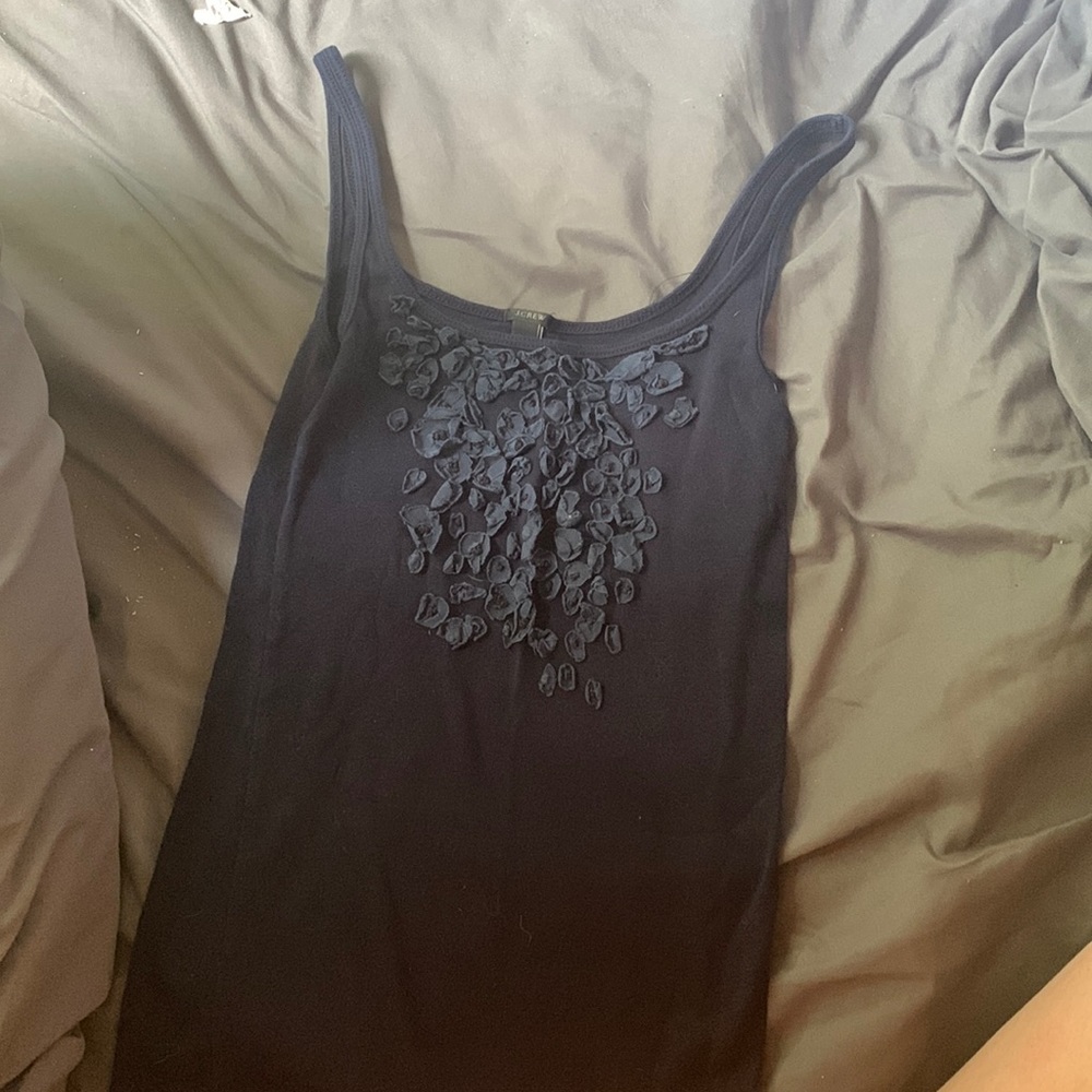 Navy blue tank top with flowers on chest. Only wore it a few times
